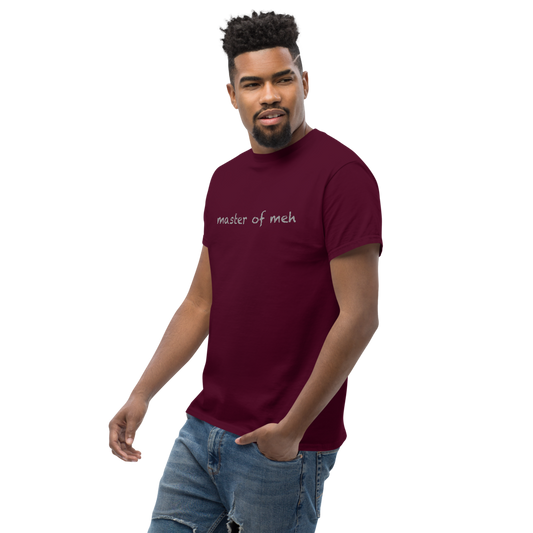 "Master of meh" printed on a maroon unisex classic tee worn by a male