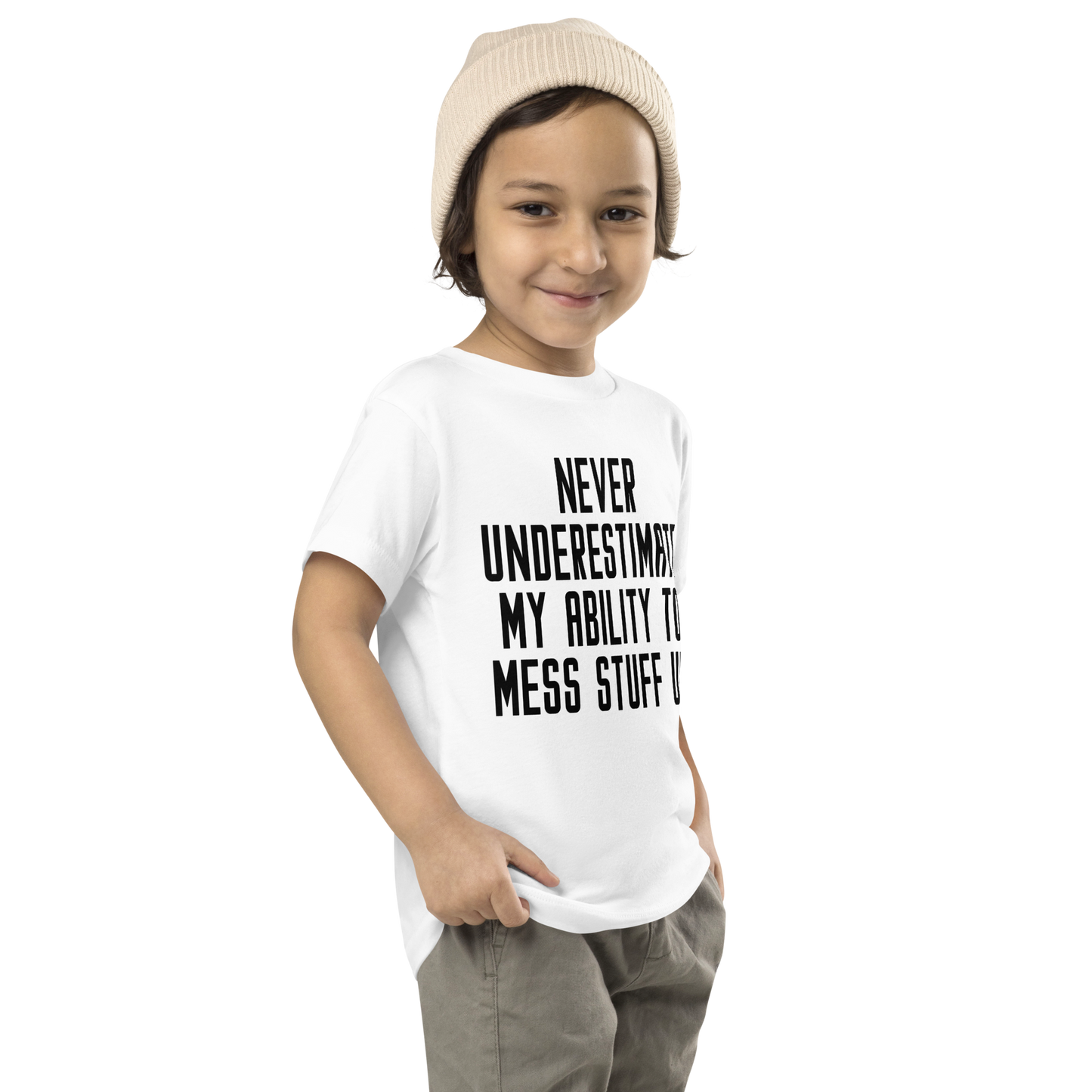 "Never Understimate My Ability To Mess Stuff Up" printed on a white toddler short sleeve tee worn by a male who is also wearing a knit cap