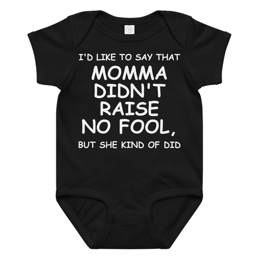 "I'd like to say that momma didn't raise no fool, but she kind of did" printed on a black baby jersey bodysuit laying on a flat surface amongst other clothes