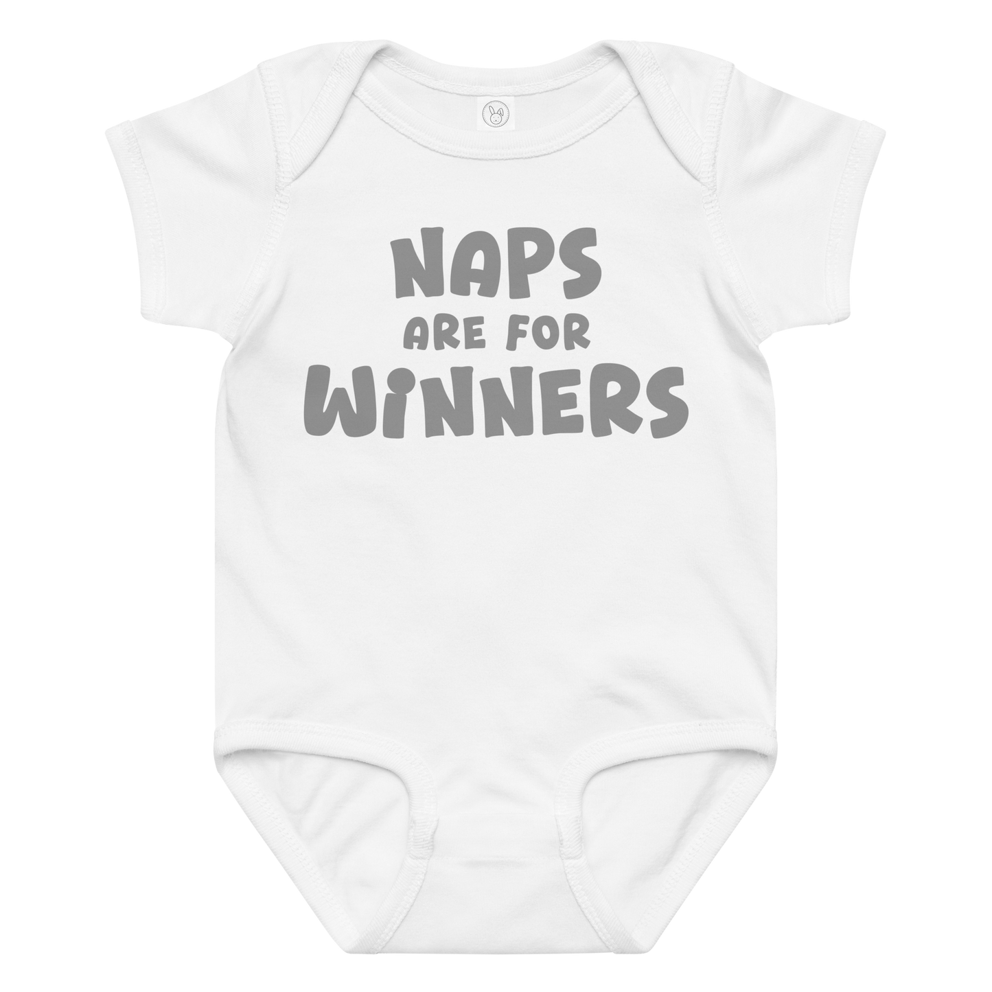 "Naps Are For Winners" printed on a white baby jersey bodysuit laying on a flat surface amongst other clothes