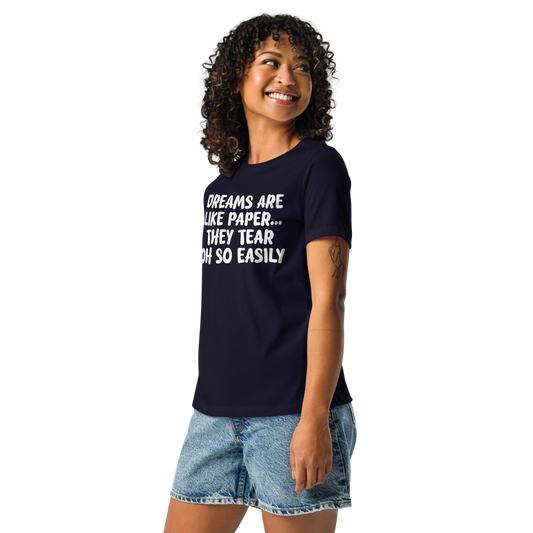 "Dreams are like paper, they tear oh so easily" printed on a navy women's relaxed t-shirt worn by a female