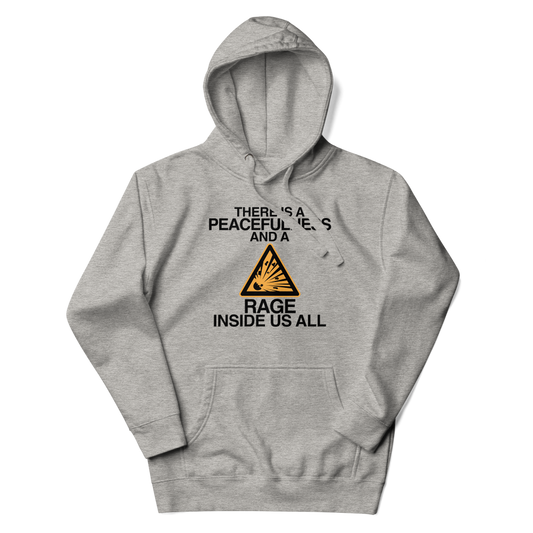 "There is a peacefulness and a rage inside us all" printed on a carbon grey unisex hoodie laying on a flat surface with the hood up