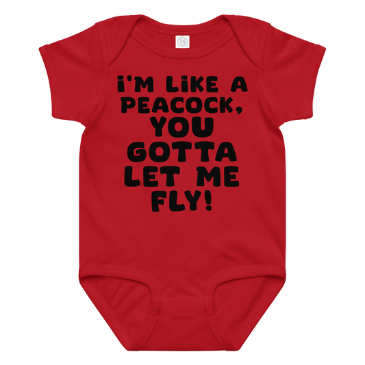 "I'm like a peacock, you gotta let me fly!" printed on a red baby jersey bodysuit laying on a flat surface amongst other clothes
