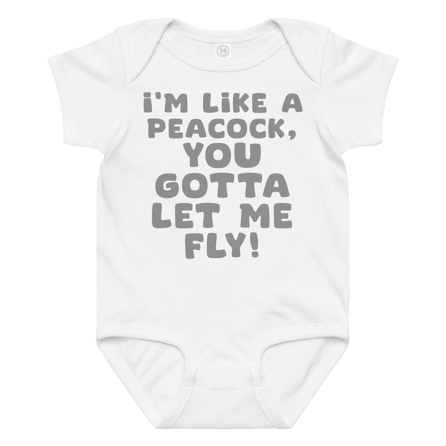 "I'm like a peacock, you gotta let me fly!" printed on a white baby jersey bodysuit laying on a flat surface amongst other clothes