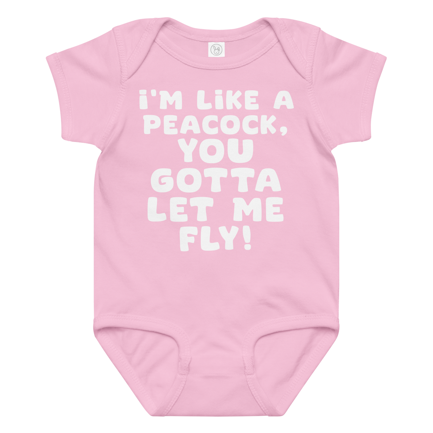"I'm like a peacock, you gotta let me fly!" printed on a pink baby jersey bodysuit laying on a flat surface amongst other clothes