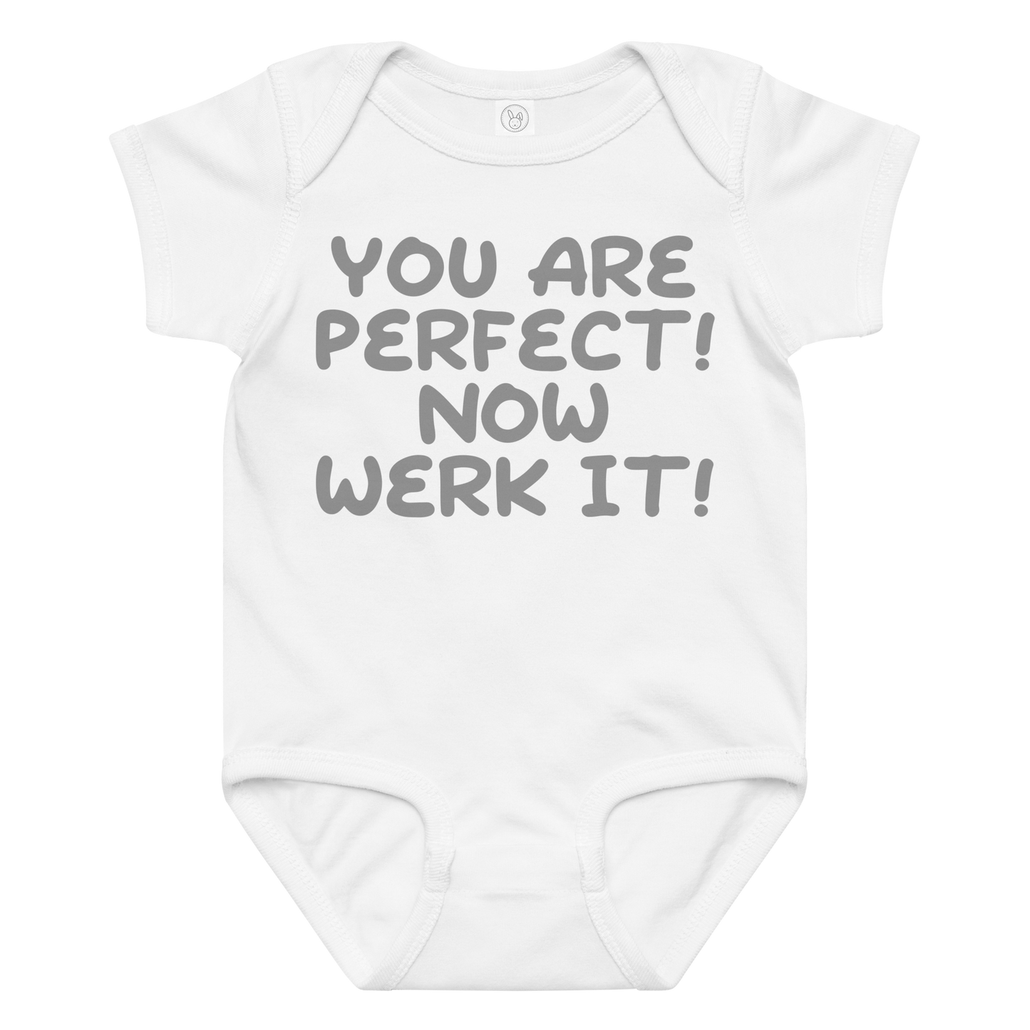 "You Are Perfect! Now Werk It!" printed on a white baby jersey bodysuit laying on a flat surface amongst other clothes