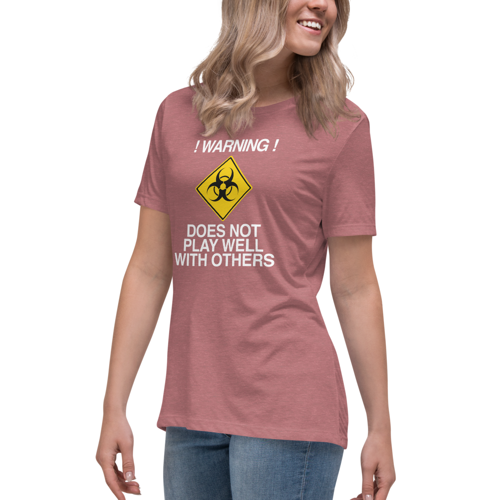 "!Warning! Does Not Play Well With Others" printed on a heather mauve women's relaxed t-shirt worn by a female