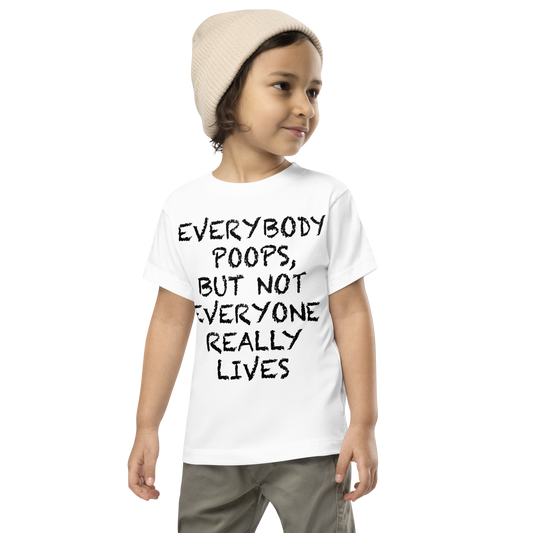 "Everybody poops, but not everyone really lives" printed on a white toddler short sleeve tee worn by a male wearing a cap