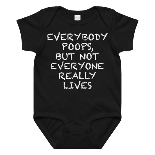 "Everybody poops, but not everyone really lives" printed on a black baby jersey bodysuit laying on a flat surface amongst other clothes