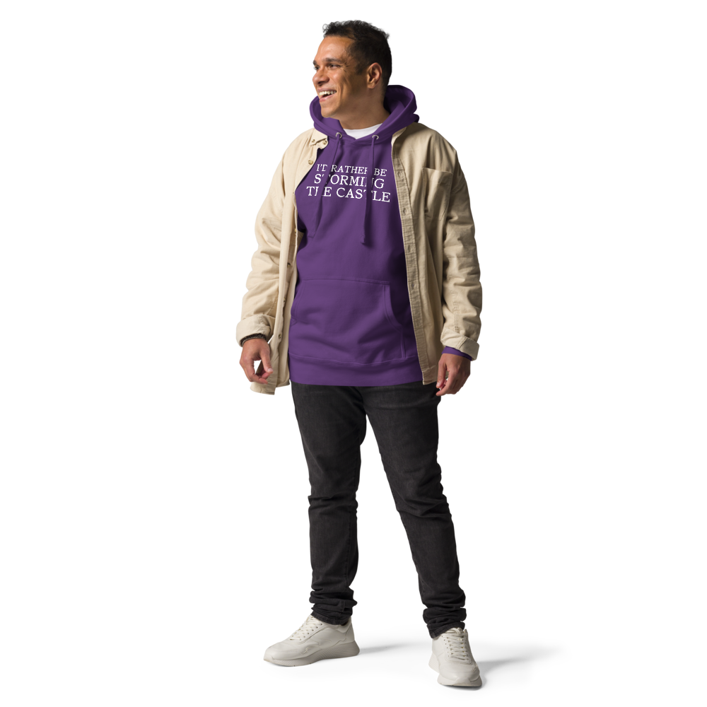 "I'd rather be storming the castle" printed on a purple unisex hoodie worn by a male with a jacket on top