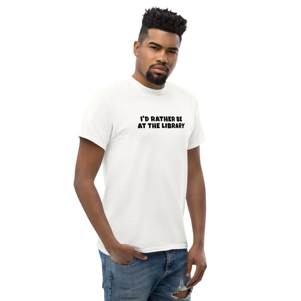 "I’d rather be at the library" printed on a white unisex classic tee worn by a male