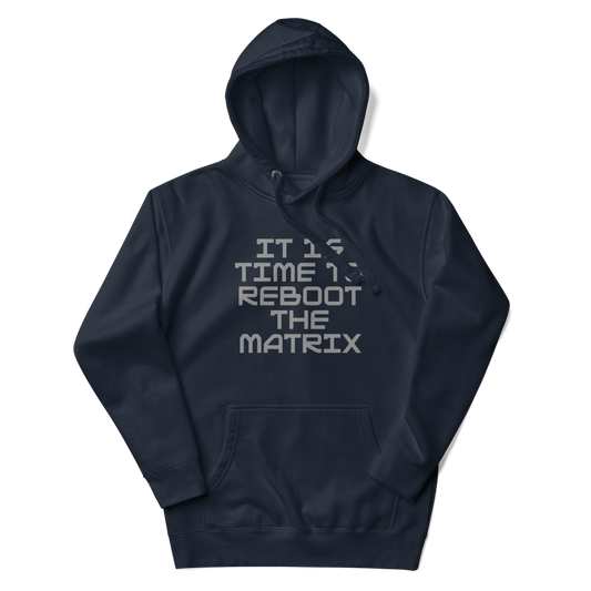 "It's time to reboot the matrix" printed on a navy blazer unisex hoodie laying on a flat surface with the hood up