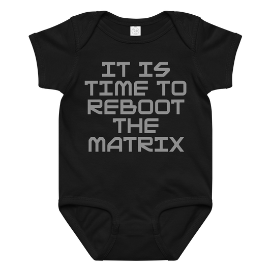 "It's time to reboot the matrix" printed on a black baby jersey bodysuit laying on a flat surface amongst other clothes