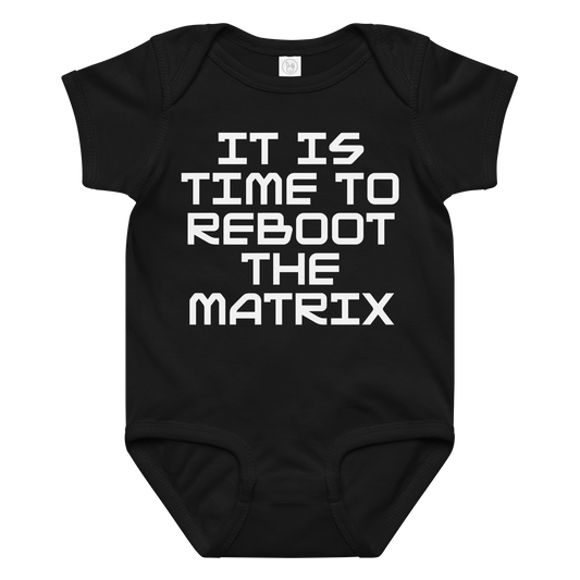 "It's time to reboot the matrix" printed on a black baby jersey bodysuit laying on a flat surface amongst other clothes