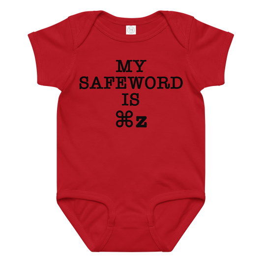 "My Safe Word Is ⌘Z" printed on a red baby jersey bodysuit laying on a flat surface amongst other clothes