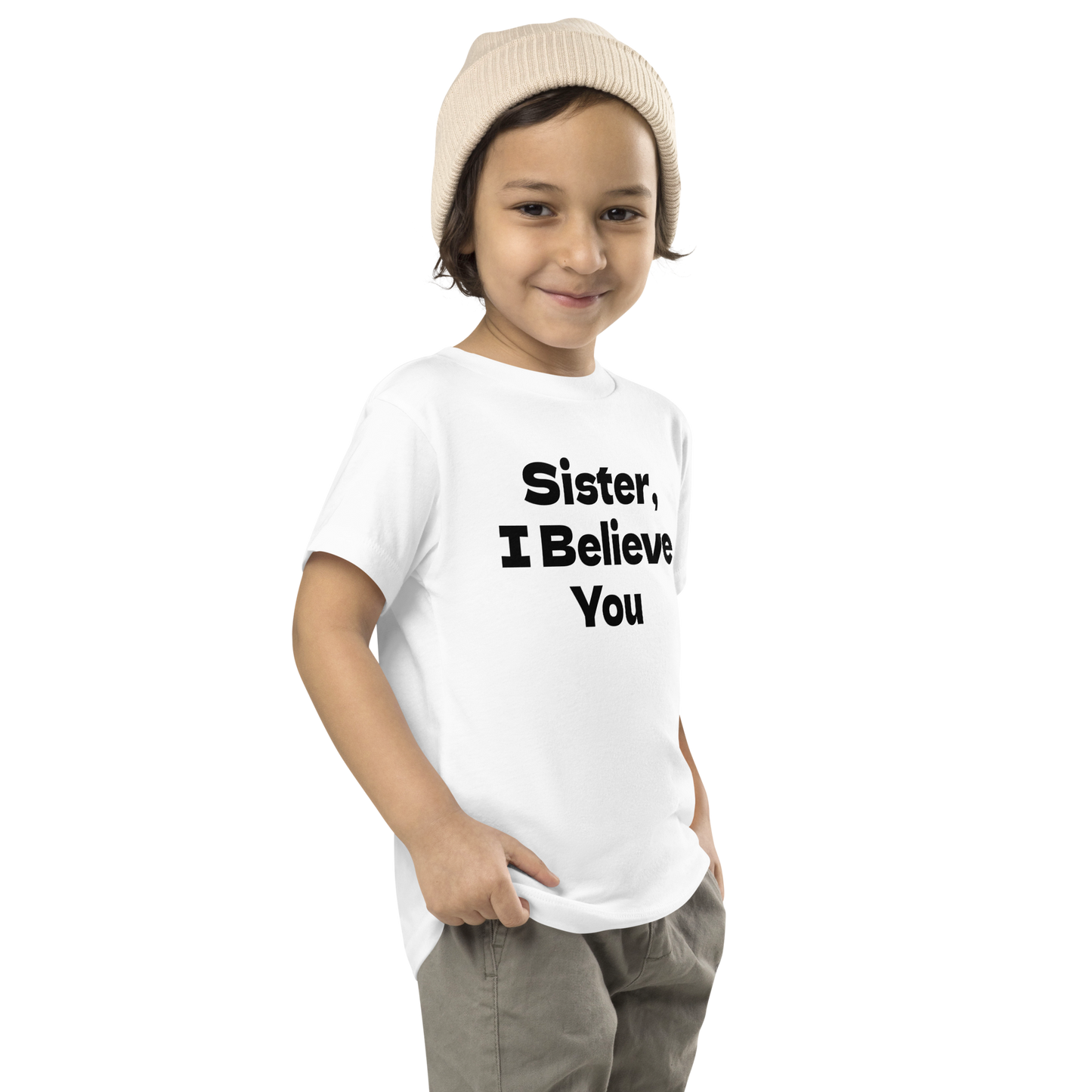 "Sister, I Believe You!" printed on a white toddler short sleeve tee worn by a male who is also wearing a knit cap