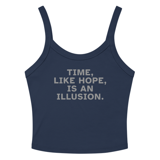 "Time, like hope, is an illusion" printed on a solid navy blend women's micro-rib tanktop laying on a flat surface amongst sunglasses and shorts