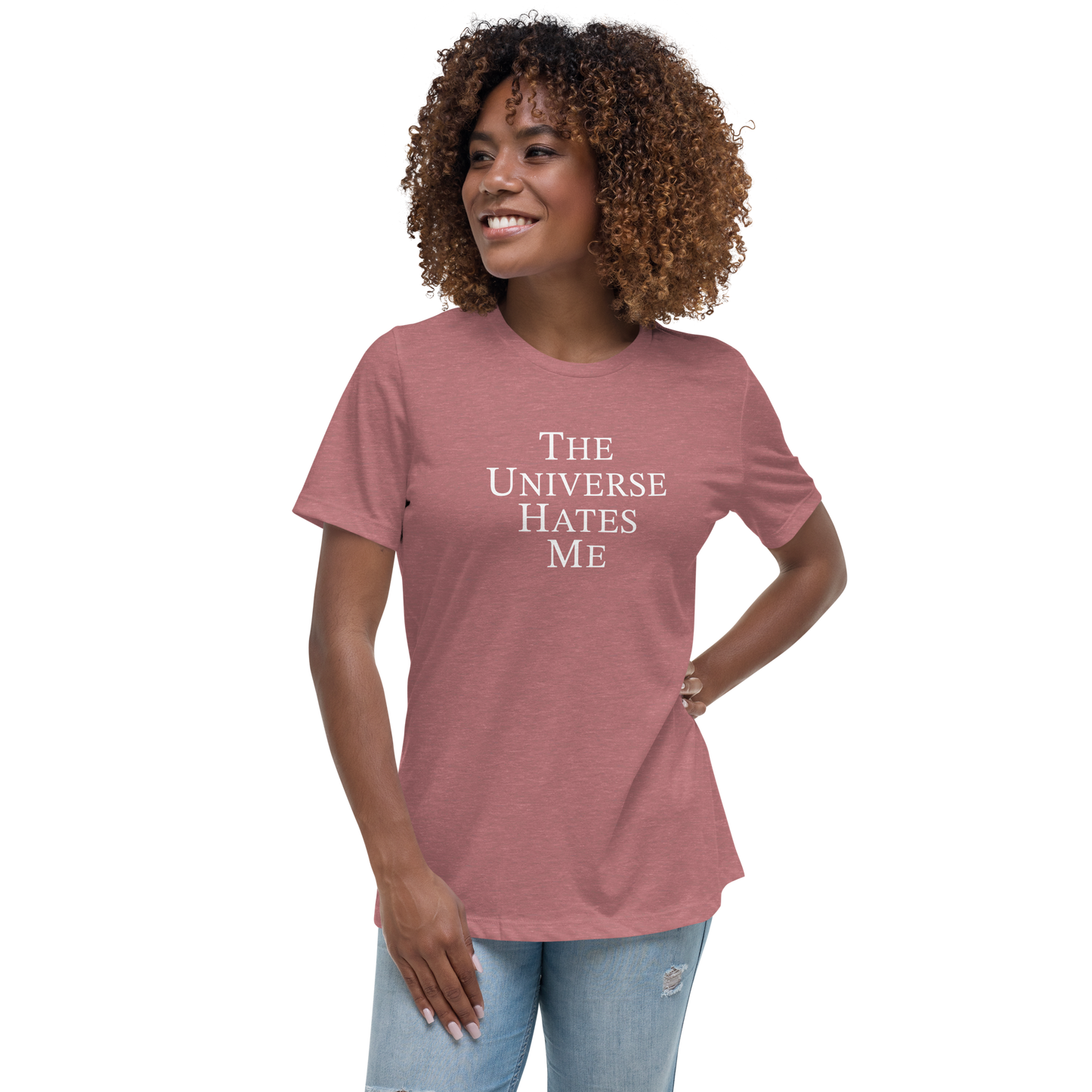 "The Universe Hates Me" printed on a heather mauve women's relaxed t-shirt worn by a female