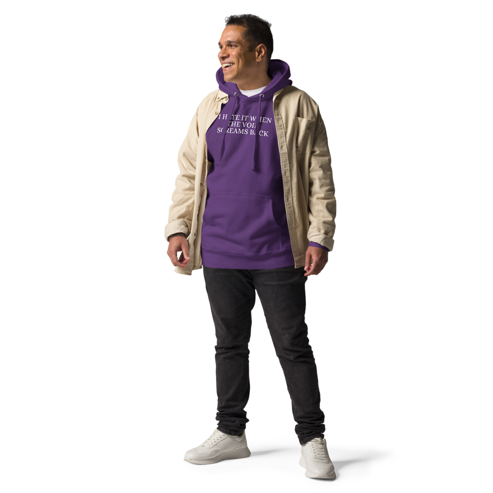 "I hate it when the void screams back" printed on a purple unisex hoodie worn by a male with a jacket on top