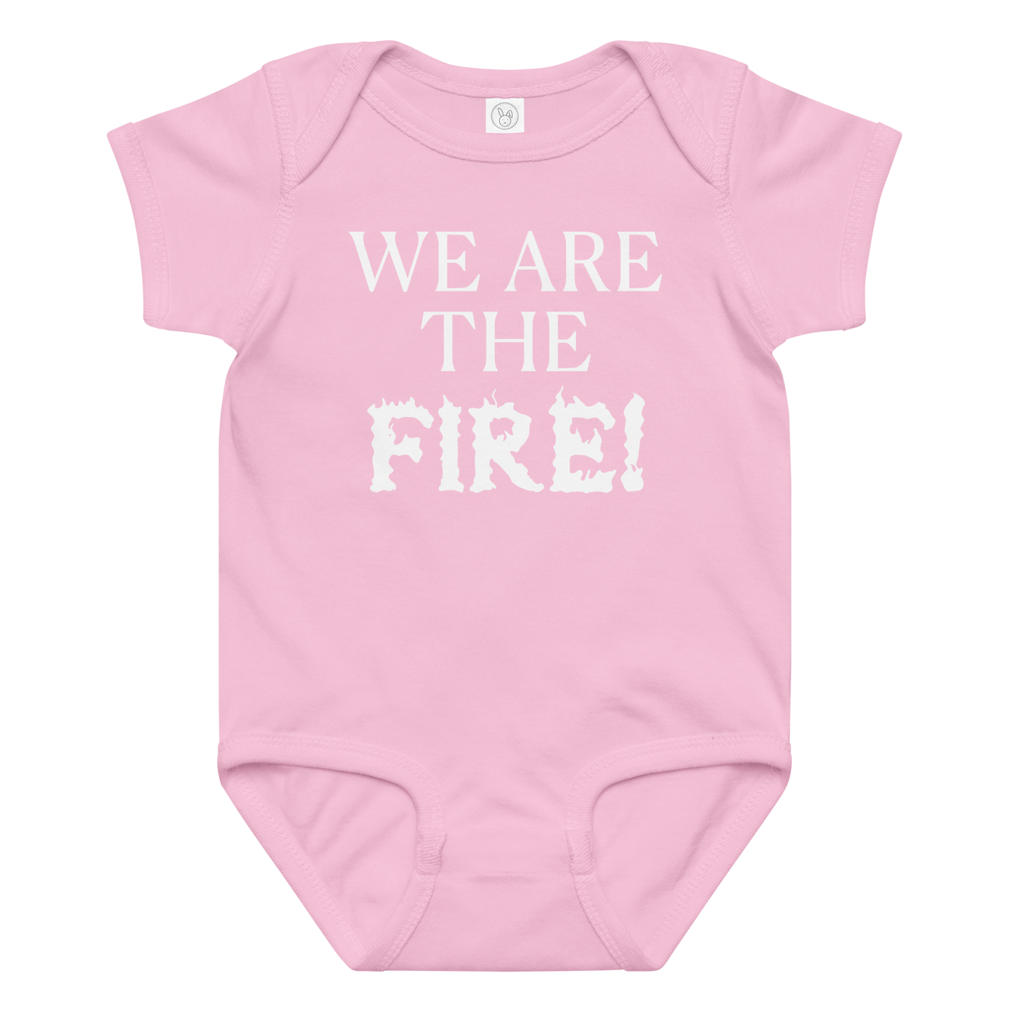"We are the fire!" printed on a pink baby jersey bodysuit laying on a flat surface amongst other clothes