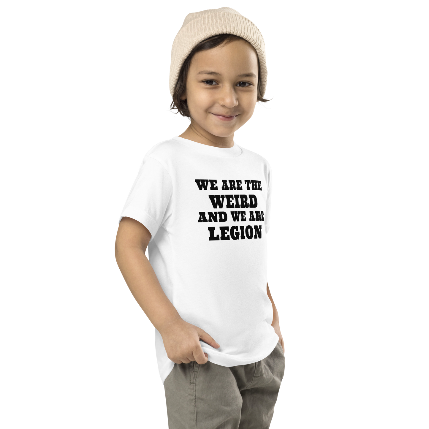 "We are the weird and we are legion" printed on a white toddler short sleeve tee worn by a male who is also wearing a knit cap