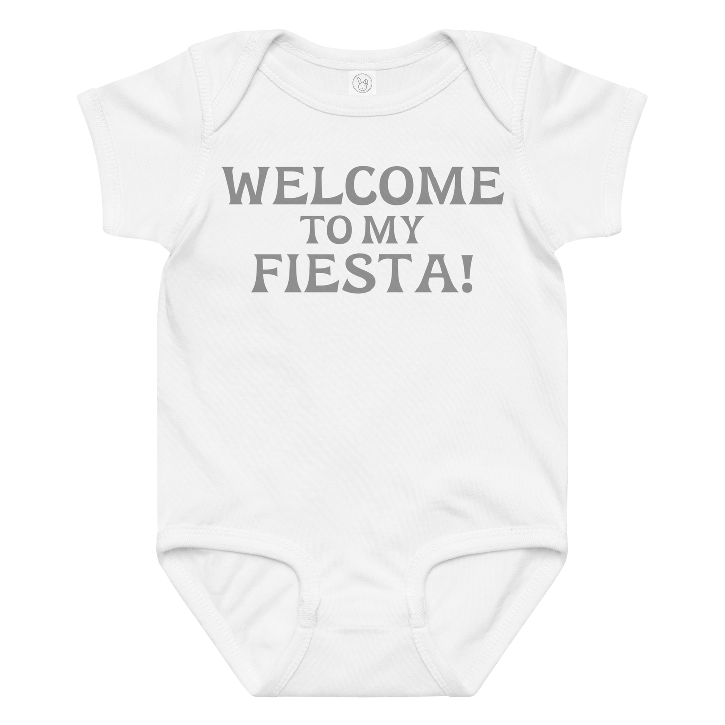 "Welcome to my fiesta!" printed on a white baby jersey bodysuit laying on a flat surface amongst other clothes