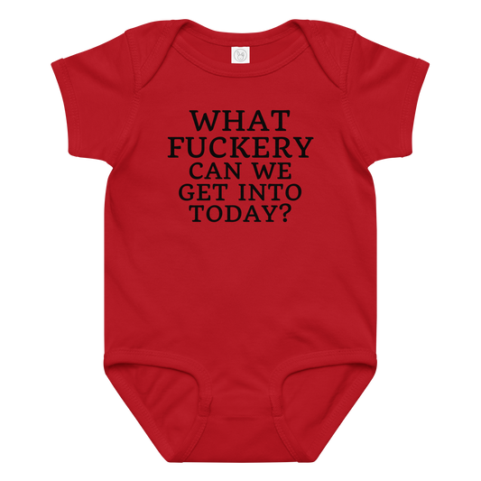 "What fuckery can we get into today?" printed on a red baby jersey bodysuit laying on a flat surface amongst other clothes