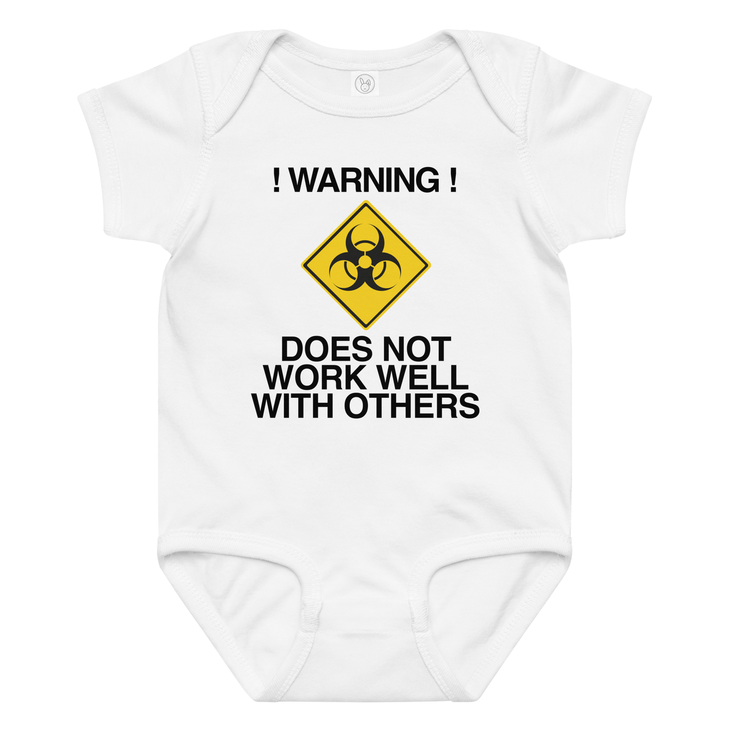 "!Warning! Does Not Work Well With Others" printed on a white baby jersey bodysuit laying on a flat surface amongst other clothes