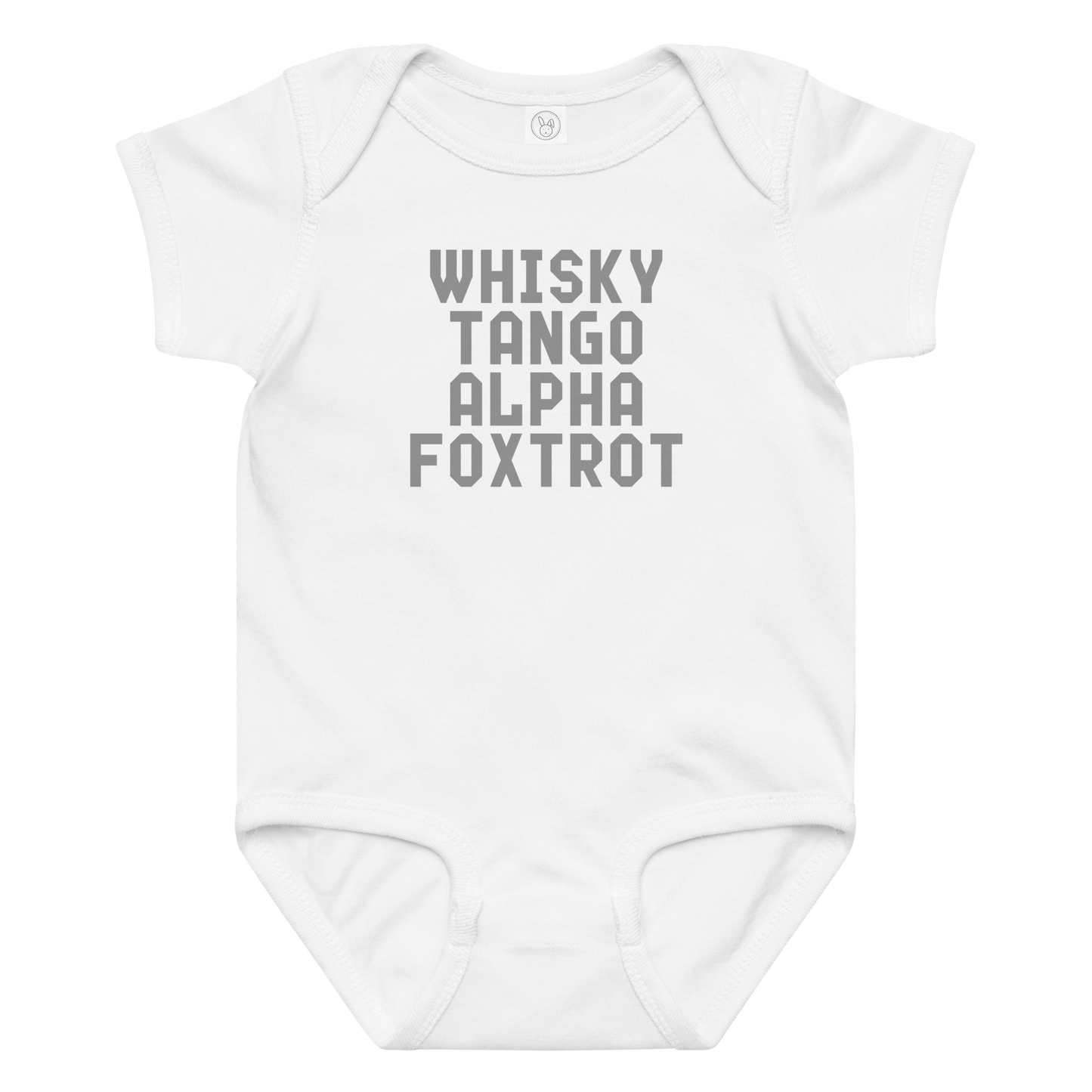 "Whisky Tango Alpha Foxtrot" printed on a white baby jersey bodysuit laying on a flat surface amongst other clothes