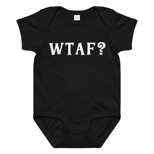 "WTAF?" printed on a black baby jersey bodysuit laying on a flat surface amongst other clothes