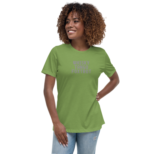 "Whisky Tango Foxtrot (What the f#ck)" printed on a leaf women's relaxed t-shirt worn by a female