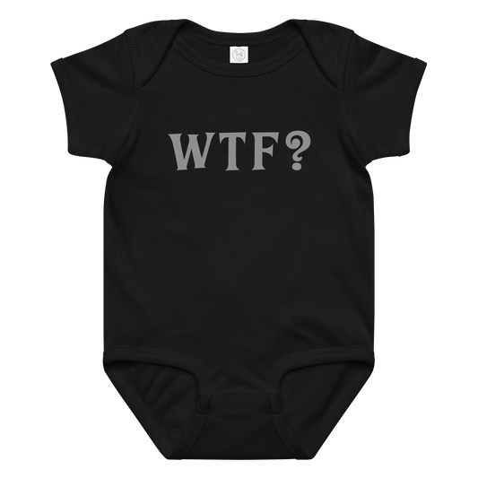 "WTF? (What the f#ck?)" printed on a black baby jersey bodysuit laying on a flat surface amongst other clothes