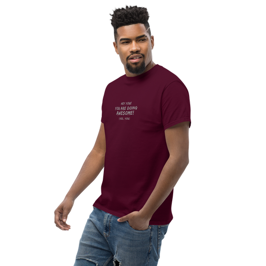 "Hey You! You are doing awesome! (Yes, you)" printed on a maroon unisex classic tee worn by a male