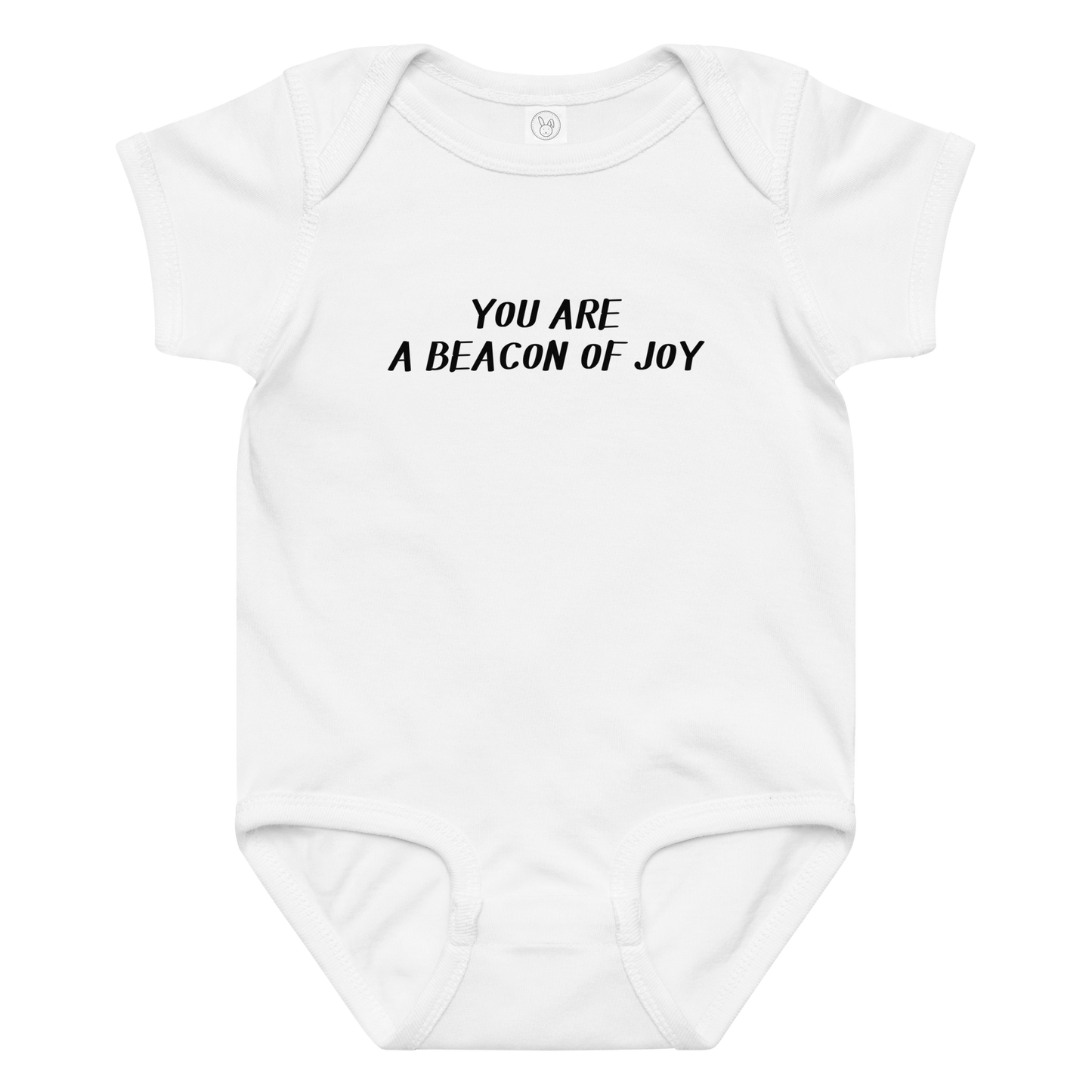 "You are a beacon of joy" printed on a white baby jersey bodysuit laying on a flat surface amongst other clothes