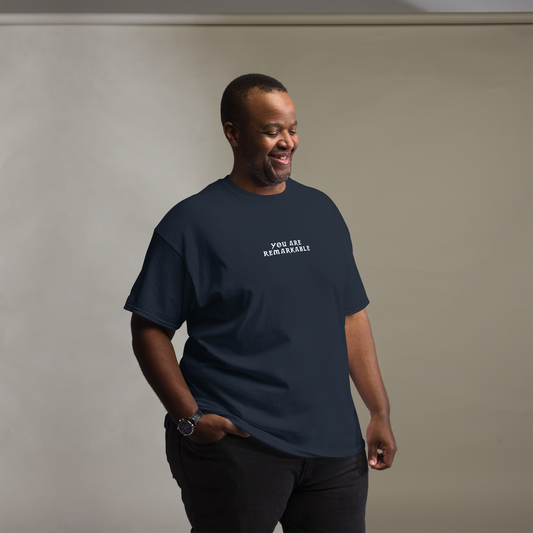 "You are remarkable" printed on a navy unisex classic tee worn by a male