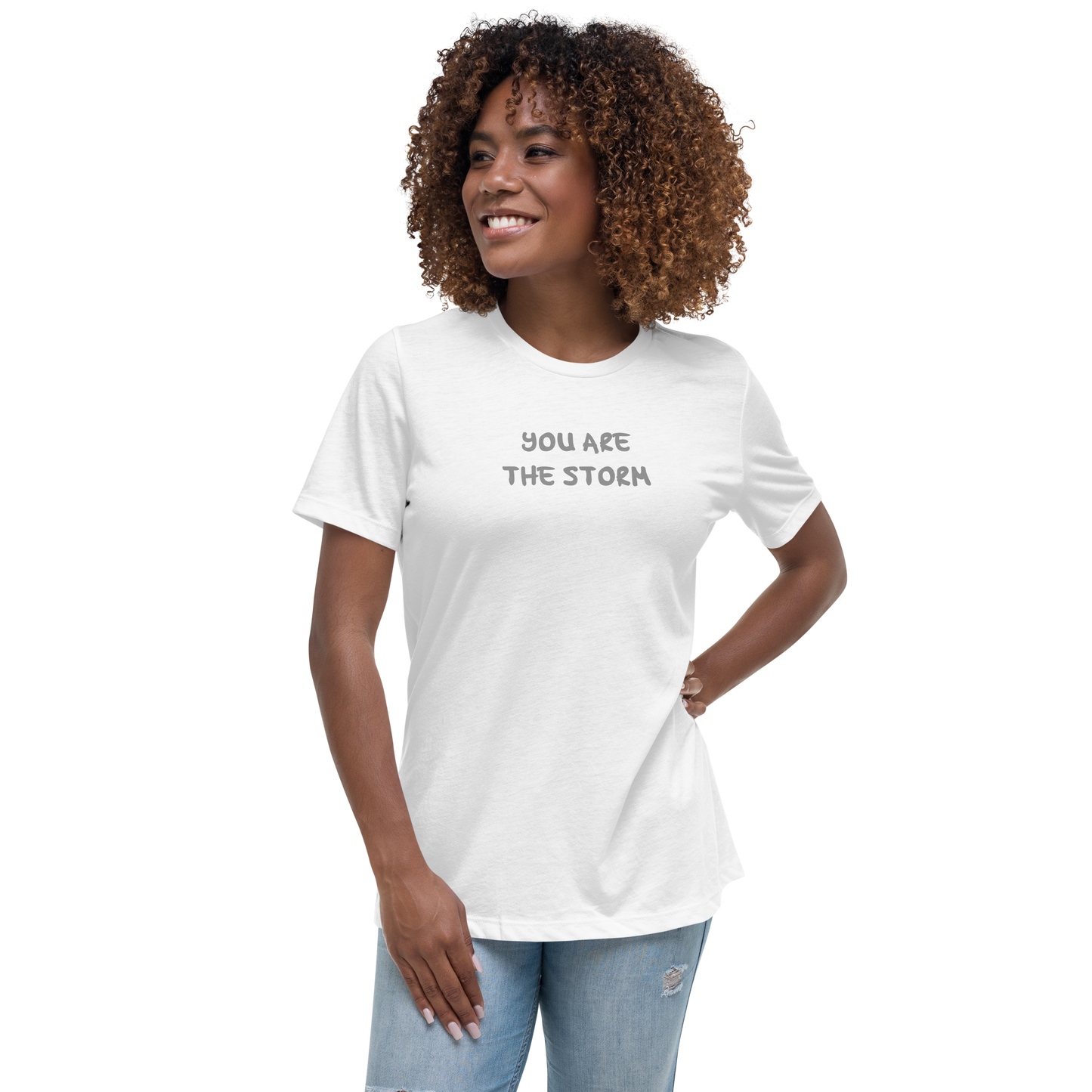 "You are the storm" printed on a white women's relaxed t-shirt worn by a female