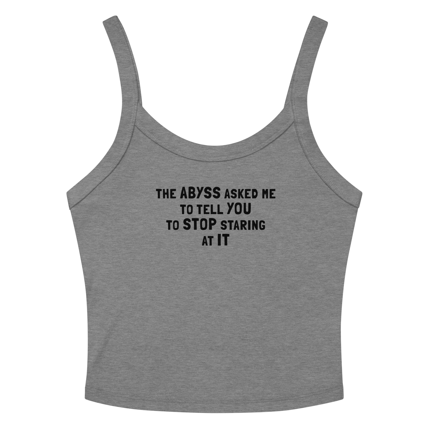 "The Abyss asked me to tell you to stop staring at it" printed on a athletic heather women's micro-rib tanktop laying on a flat surface amongst sunglasses and shorts