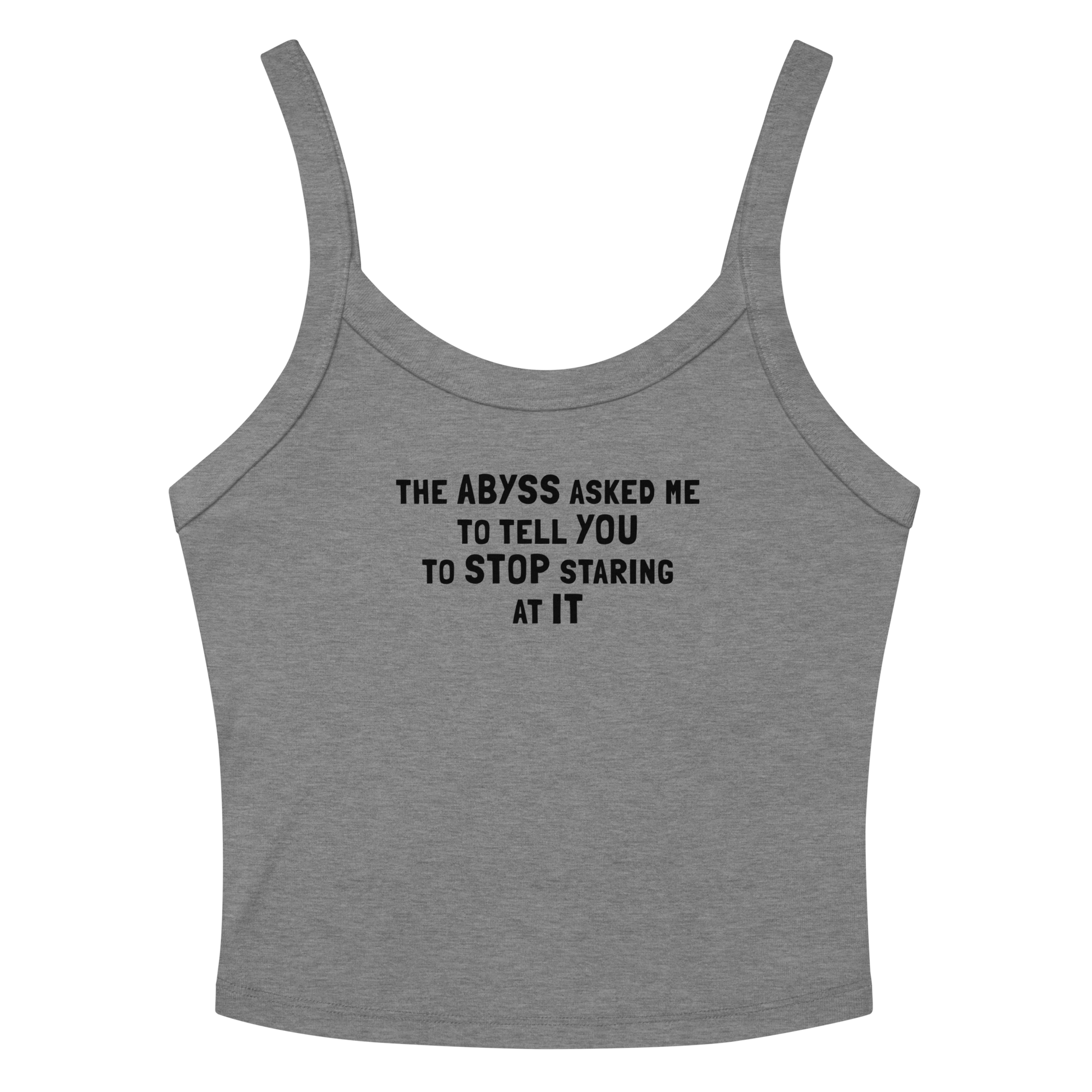 "The Abyss asked me to tell you to stop staring at it" printed on a athletic heather women's micro-rib tanktop laying on a flat surface amongst sunglasses and shorts