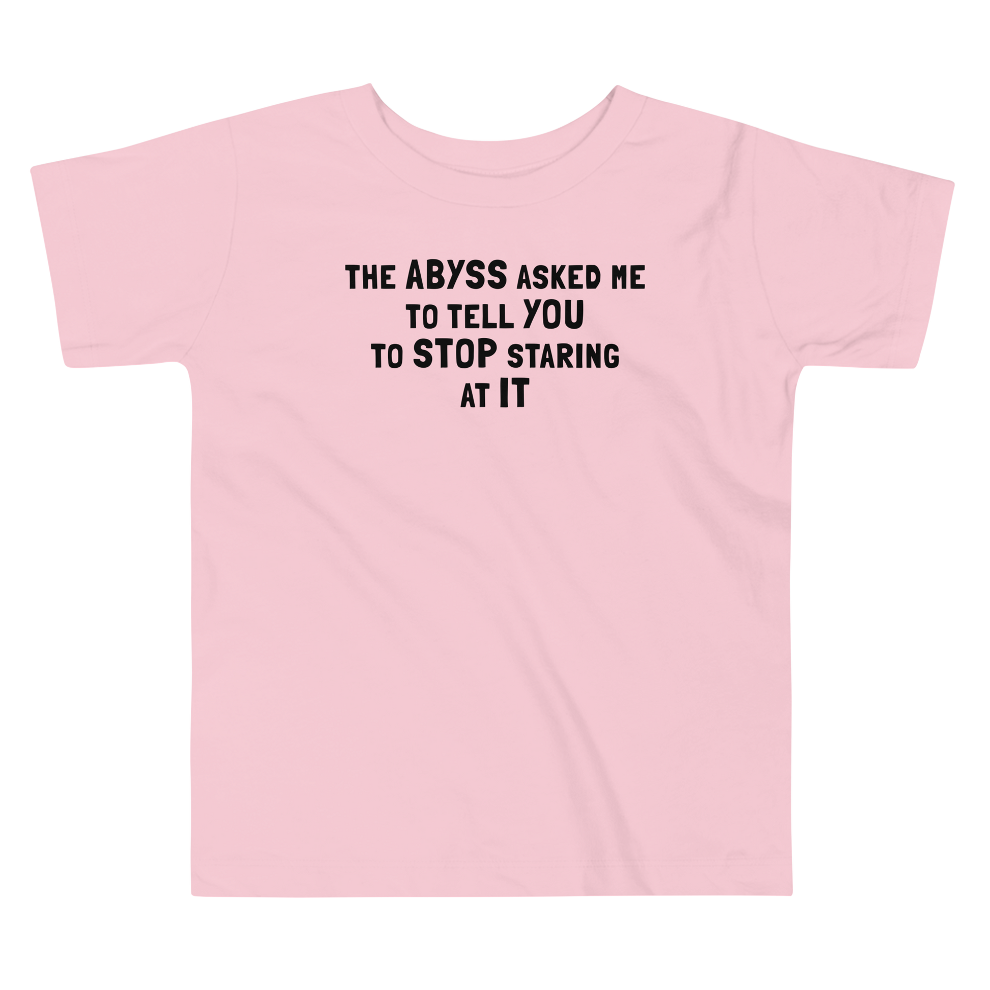 "The Abyss asked me to tell you to stop staring at it" printed on a pink toddler short sleeve tee laying on a flat surface