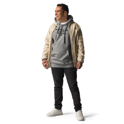 "The Abyss asked me to tell you to stop staring at it" printed on a carbon grey unisex hoodie worn by a male with a jacket on top