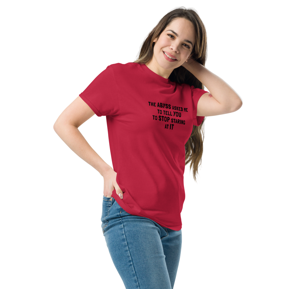 "The Abyss asked me to tell you to stop staring at it" printed on a cardinal unisex classic tee worn by a female