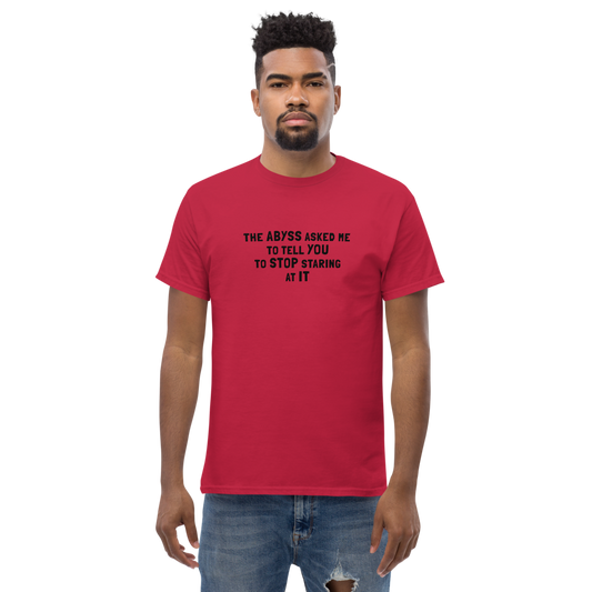 "The Abyss asked me to tell you to stop staring at it" printed on a cardinal unisex classic tee worn by a male