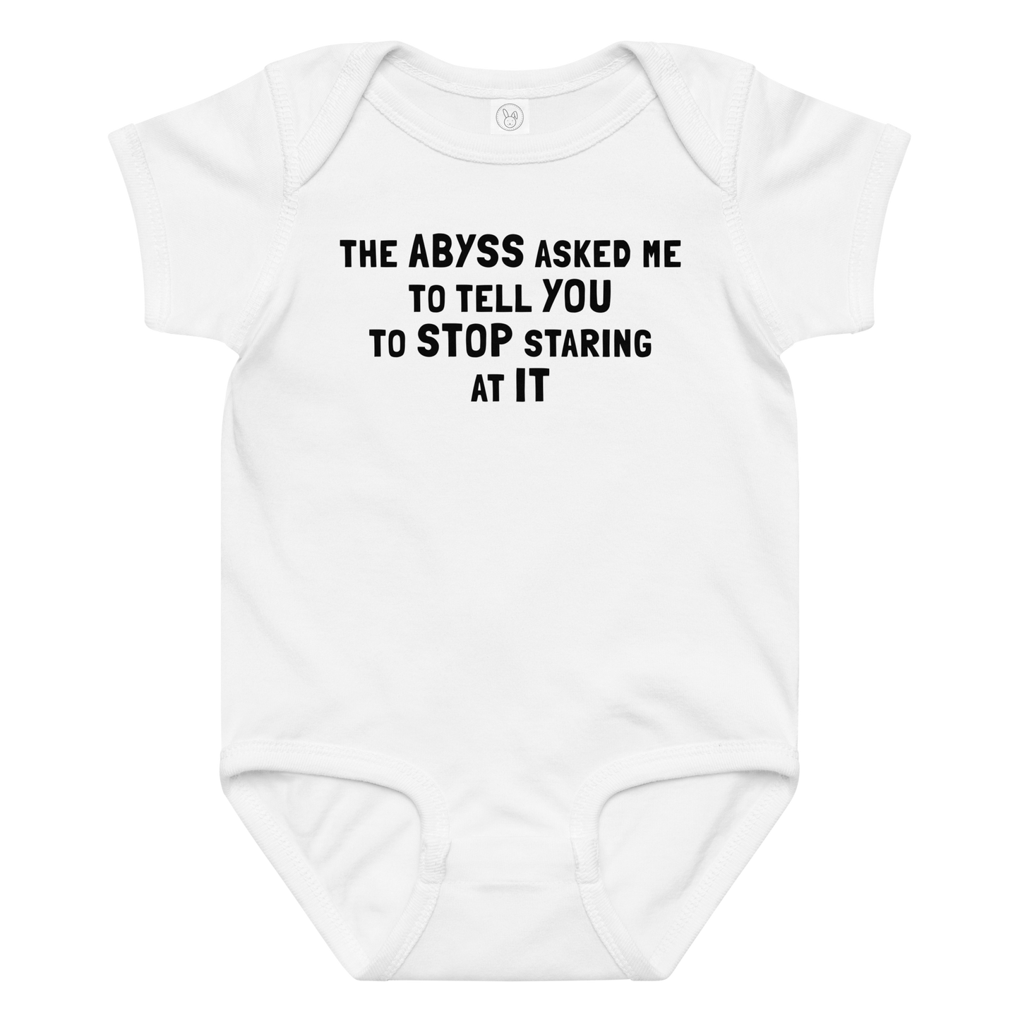 "The Abyss asked me to tell you to stop staring at it" printed on a white baby jersey bodysuit laying on a flat surface amongst other clothes