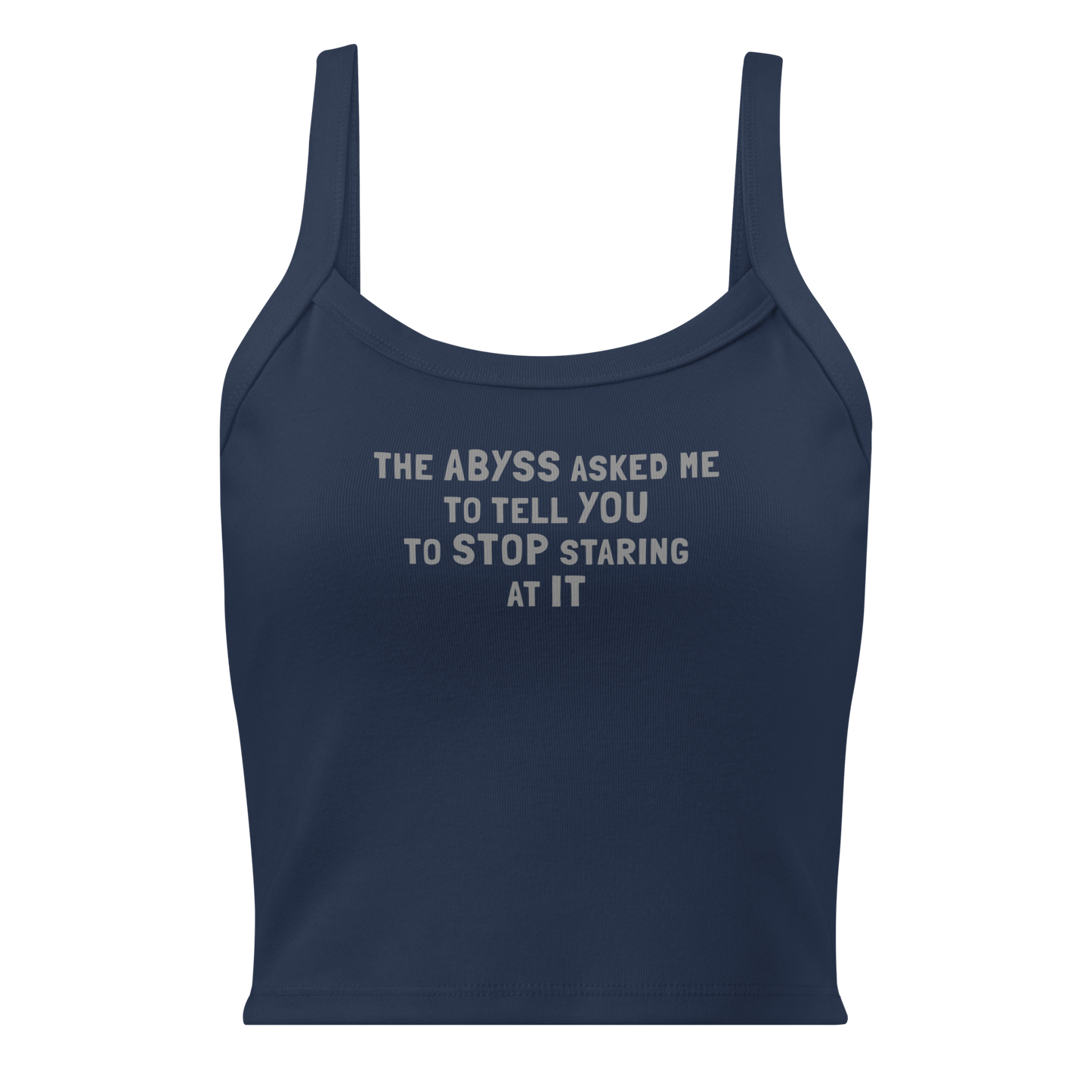 "The Abyss asked me to tell you to stop staring at it" printed on a solid navy blend women's micro-rib tanktop laying on a flat surface