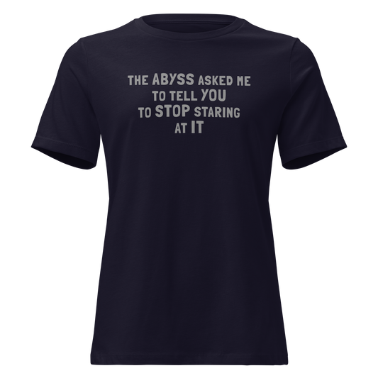 "The Abyss asked me to tell you to stop staring at it" printed on a navy on an invisible / simulated body