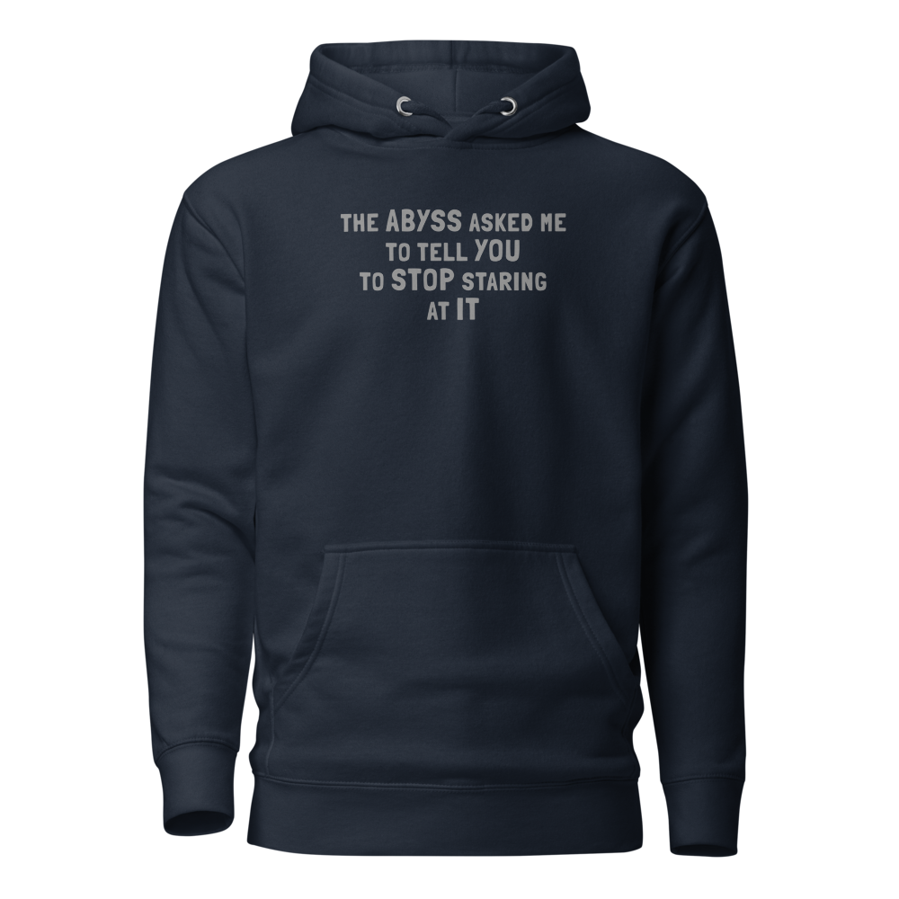 "The Abyss asked me to tell you to stop staring at it" printed on a navy blazer on an invisible / simulated body