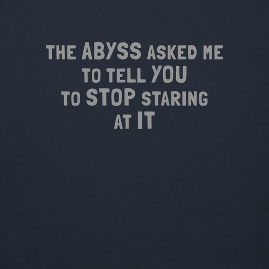 "The Abyss asked me to tell you to stop staring at it" printed on a navy blazer background