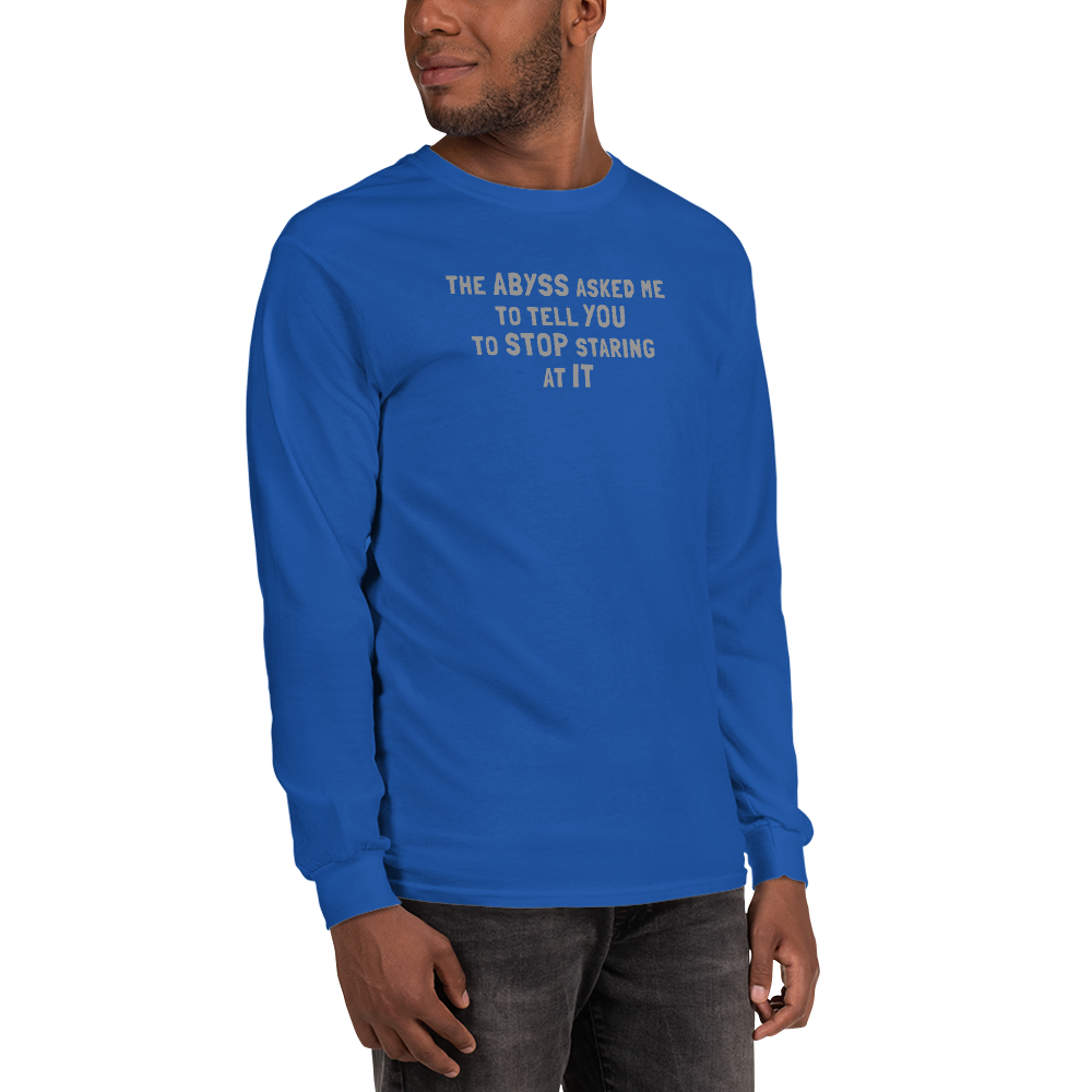 "The Abyss asked me to tell you to stop staring at it" printed on a royal men's long sleeve shirt worn by a male
