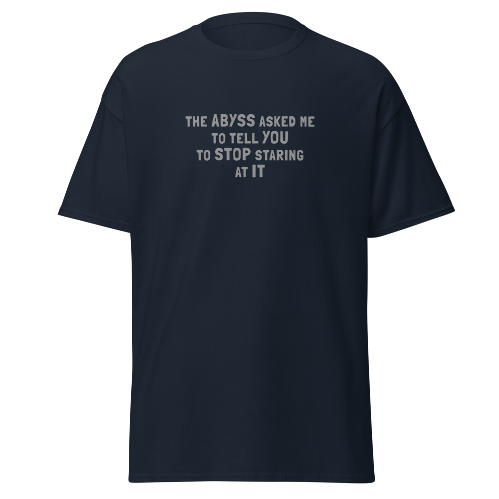 "The Abyss asked me to tell you to stop staring at it" printed on a navy on an invisible body
