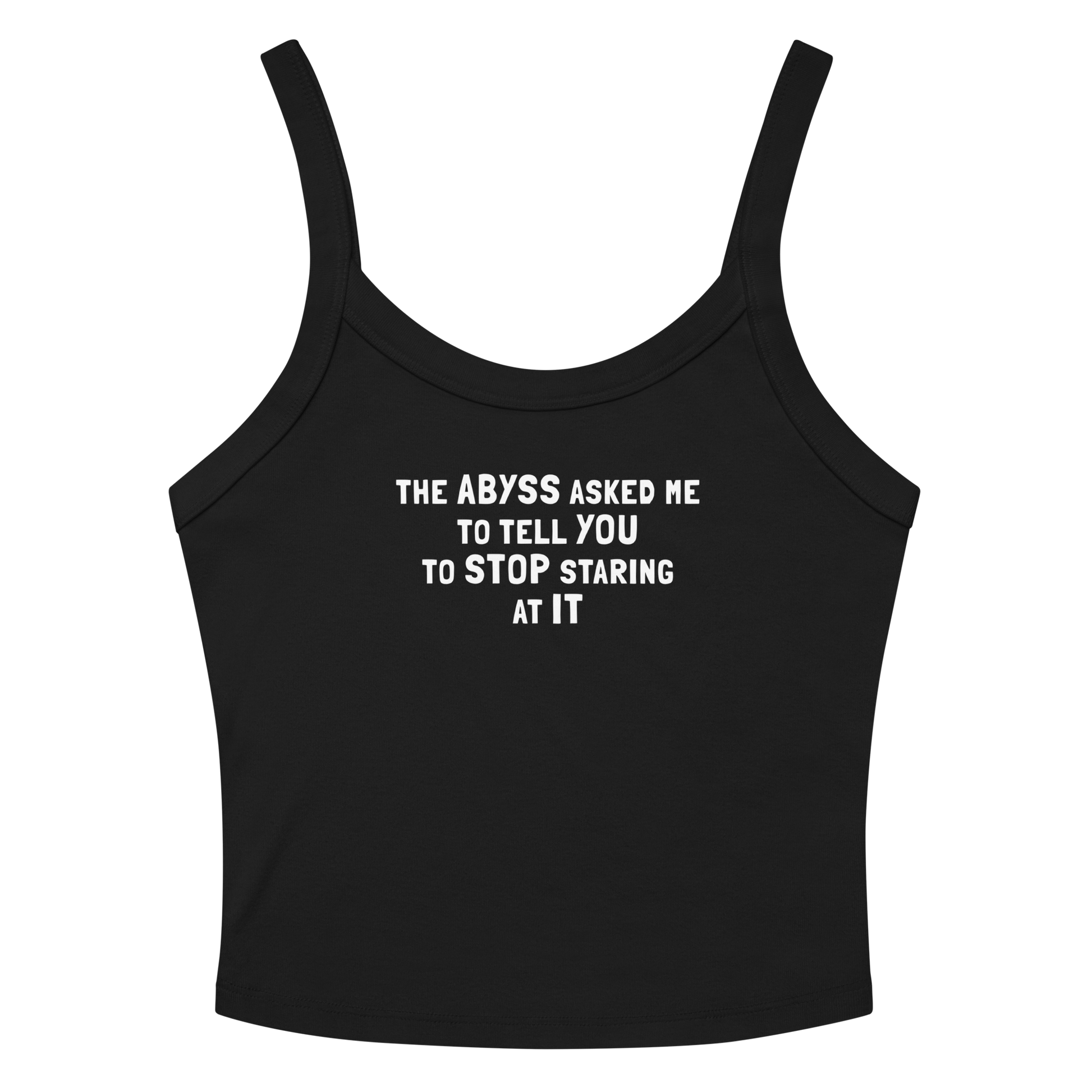 "The Abyss asked me to tell you to stop staring at it" printed on a solid black blend women's micro-rib tanktop laying on a flat surface amongst sunglasses and shorts